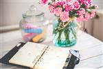 calendar book with flowers on a table 